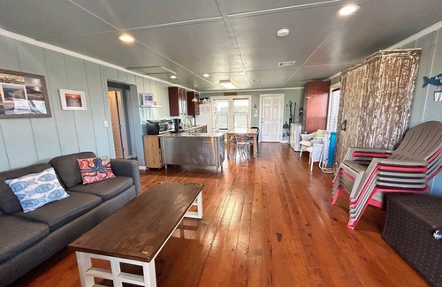Golden Meadow House | Experience waterfront living at Wahoo in Grand Isle, LA, with boat access and cozy amenities.