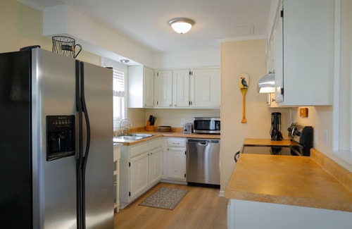Emerald Isle Cottage | Family beach cottage poised between the ocean, hiking, biking, eateries & shops