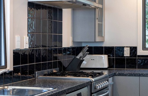 Russell House | Family Friendly Beach Oasis with Modern Comforts