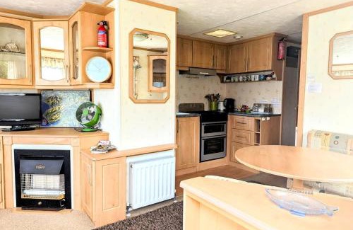 Bryn-crug Ski Chalet | Family-Friendly Woodland Caravan Pool & Bar