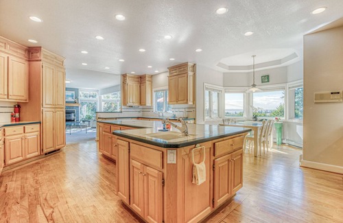 Clinton House | Family friendly water view escape with deck, games and garden views