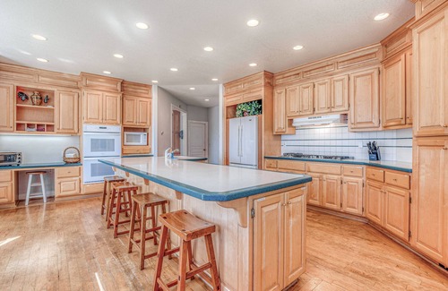 Clinton House | Family friendly water view escape with deck, games and garden views