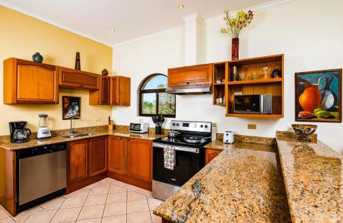 Tamarindo Apartment | Family Setting, Big Pool Beach Facing In Towns
