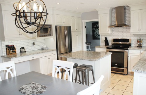 Crawford House | Family Vacation Oasis: Heated Pool, 5 bedrooms, 1/2 acre property, covered patio