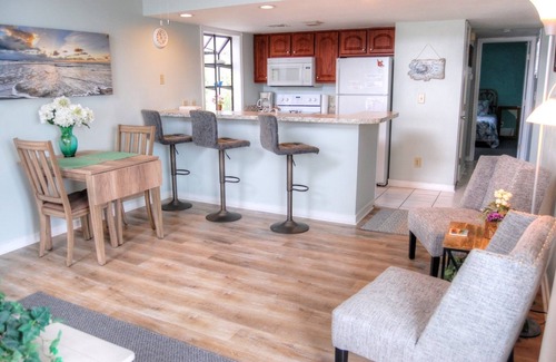 Vaught Condo | Fantastic Condo Adjacent to Harry the Hats and Across from the Apache Pier -