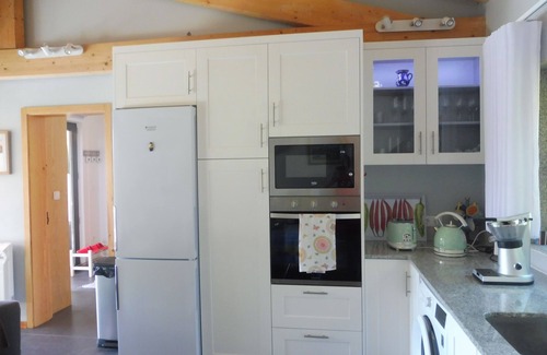Portela House | Farmhouse accommodation for 10 people, with private pool, BBQ, garden and Wifi .