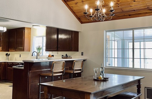 Three Rivers House | Farmhouse-style home with mountain and river views