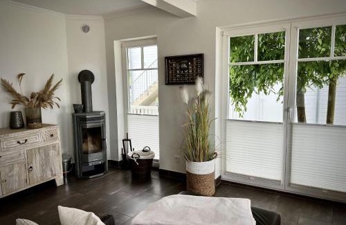 Olpenitz House | Ferienhaus-Sliminde-by-Seeblick-Ferien-direkte-Wasserlage-E-Ladesaeule-Sauna