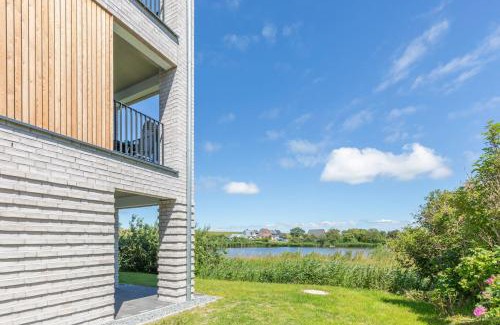Norderhafen Apartment | Ferienwohnung Nord-West - direkt am Nordseedeich mit Blick auf den See