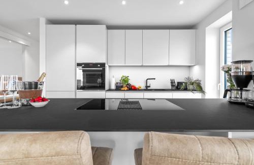 Kappeln Apartment | Ferienwohnung Nordglanz – Modernes Beachhouse-Flair im Herzen des OstseeResort Olpenitz