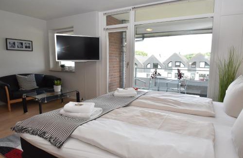 Wassersleben Apartment | fewo1846 Strandresidenz Wassersleben - Fjordblick - modernes Studioapartment mit Balkon und Meerblick