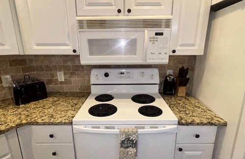 White Oak Lodge Apartment | Fireplace Pool Table Pool Fitness Room