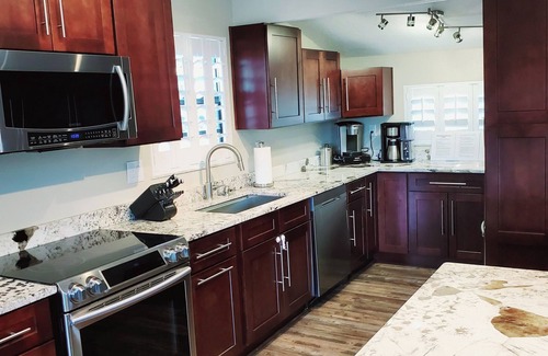 Palm Harbor House | Florida Life on the water with game room, heated pool, kayaks +nPet friendly!