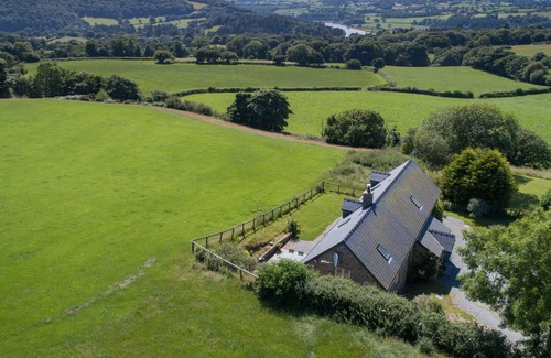 Eglwysbach Cottage | Four bedrooms, three en-suite shower rooms. Sleeps 7. Ample parking.