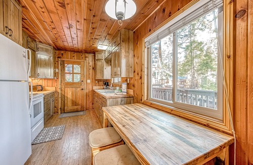 West Village House | Friendly cabin-style home with private gas grill, wood-burning stove, & deck