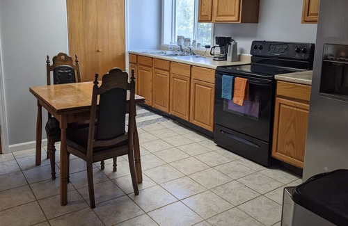 Independence Apartment | Full apt with private entrance, off street parking, HUGE backyard! close to Ark!