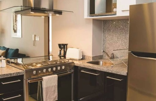 Ampliacion Granada Apartment | Fully equipped kitchen, high speed internet, comfy king-size bed and a sofa bed.