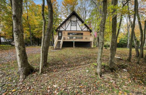 Pocono Lake House | Game Room and Fire Pit Tree-Lined Pocono Lake Cabin