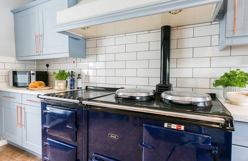 Bryngwran Cottage | Gamekeeper's - a hot tub that sleeps 4 guests in 2 bedrooms