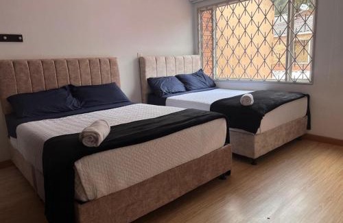 Calle 26 Apartment | Garden's Aparta hotel