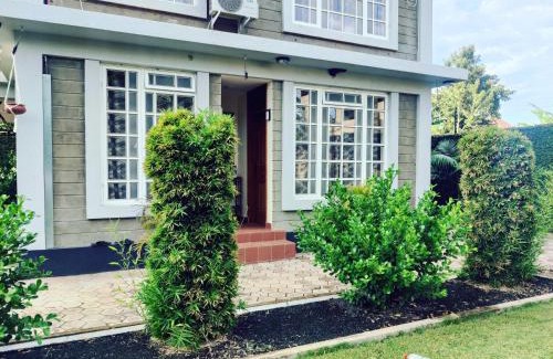 Arusha House | Garden View with detached Bathroom