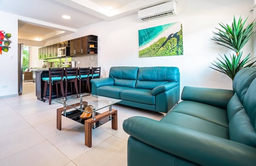 Villarreal Condo | Gated resort condo with on-site pool, outdoor areas, private patio, & W/D