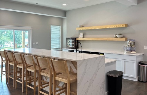 Grove House | Giant10-bedroom lakefront home with large pool, hot tub, and dock