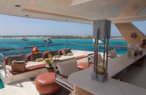 La Savina Boat Rental | Goldfinger - Floating Home', a luxury catamaran yacht on the island of Formentera