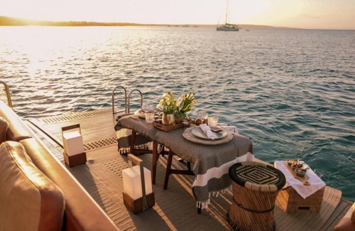 La Savina Boat Rental | Goldfinger - Floating Home', a luxury catamaran yacht on the island of Formentera