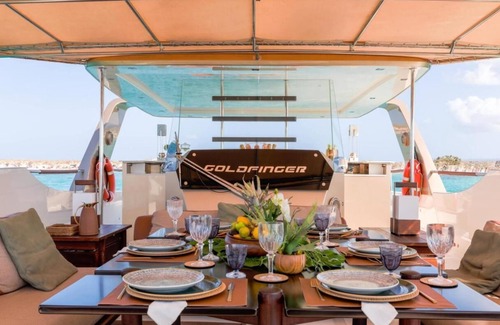 La Savina Boat Rental | Goldfinger - Floating Home', a luxury catamaran yacht on the island of Formentera