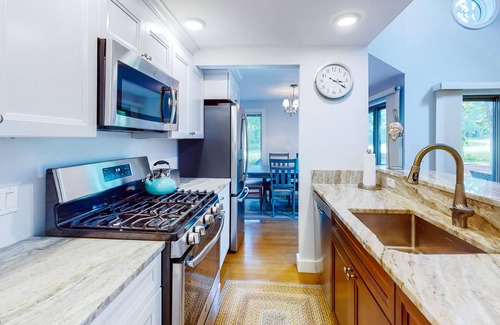 Mews Village House | Golf-course-front townhome with leafy patio & prime location near the beach
