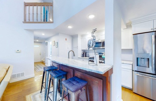 Mews Village House | Golf-course-front townhome with leafy patio & prime location near the beach