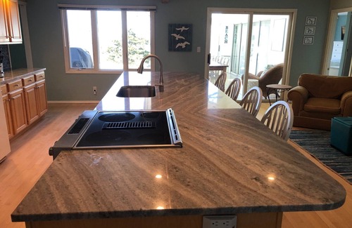 Riverside House | GORGEOUS lake view, large yard w/firepit, rooftop solar, 4 min drive to beach