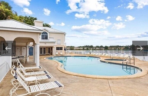 North Naples Condo | GORGEOUS - LAKEFRONT CARRIAGE HOME-1ST FLOOR LIVING-2 BED/2 BATH-2 POOLS