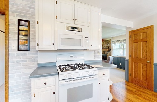 Minocqua House | Gorgeous lakefront home with dock, sandy beach area, fireplace, huge deck & WIFI