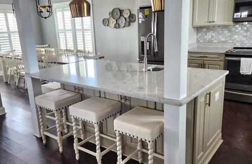 Ocean Isle Estates House | Grand beach home with elevator, private hot tub, game room, & pool access