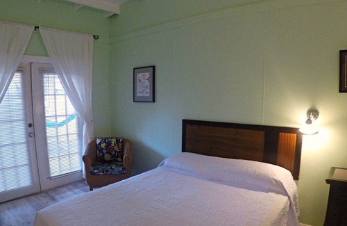 Cockburn Town House | Grand Turk Vibes B&B - Balcony room, with 2 queen beds with partial ocean view!