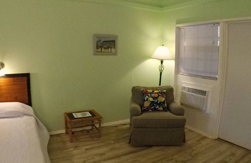 Cockburn Town House | Grand Turk Vibes B&B - Balcony room, with 2 queen beds with partial ocean view!