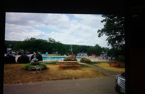 Laconia Resort | Great location with lake views ,pool and private beach.