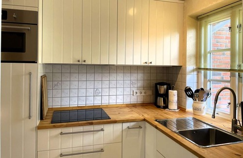 Wyk auf Foehr Apartment | Green Eilun 13 - Modernes Reihenhaus mit Garten, Spielecke, Waldzugang und Nähe zum Südstrand