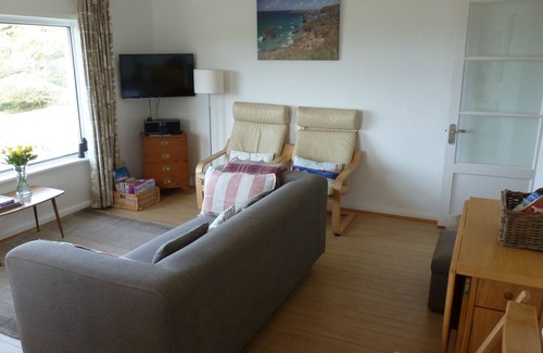 Trenance Apartment | Ground floor apartment in Mawgan Porth with sea views, sleeps 4, dog friendly.