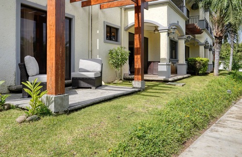 Villarreal Condo | Ground-floor condo with pool & garden views, terrace, hot tub, AC, & W/D
