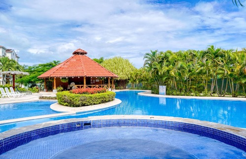 Villarreal Condo | Ground-floor condo with pool & garden views, terrace, hot tub, AC, & W/D
