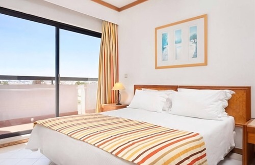 Areias de Sao Joao Hotel | Hassle-Free and Suiting Stay! Fully-furnished 1BR with Balcony and Kitchen!
