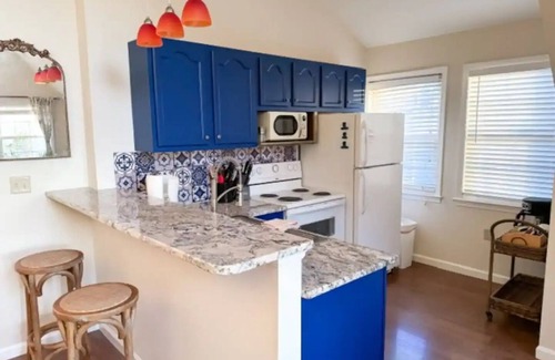 Salisbury Apartment | Havana Hideaway: A tropical retreat where vibrant decor meets pastoral views.