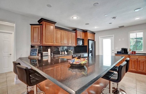 Oakland Park Villa | Heated Pool Tropical Oasis Water Slide