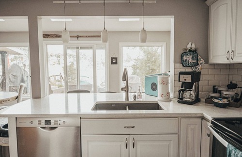 Portage Lakes Cottage | HEAVENLY Portage Lakes water front 4-bedroom cottage with HOTTUB, dog friendly!