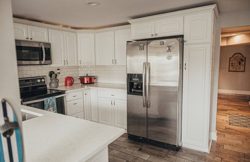 Portage Lakes Cottage | HEAVENLY Portage Lakes water front 4-bedroom cottage with HOTTUB, dog friendly!