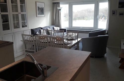 Heist Apartment | Heist, apartment with transverse view of the dike, the dunes and the sea