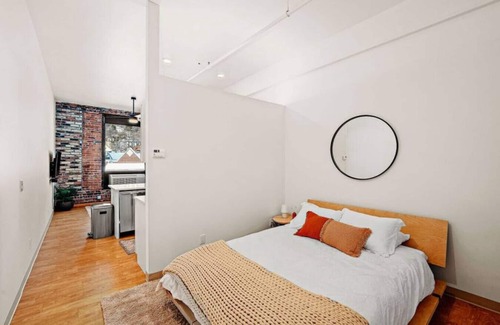 Duluth Apartment | High Ceilings & Windows + Exposed Brick + Central